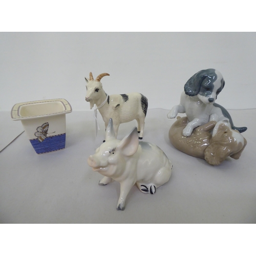 233 - Mixed ceramics, viz. a Beswick goat and pig; a pair of Nao playing puppies; and a Wedgwood planter&n... 