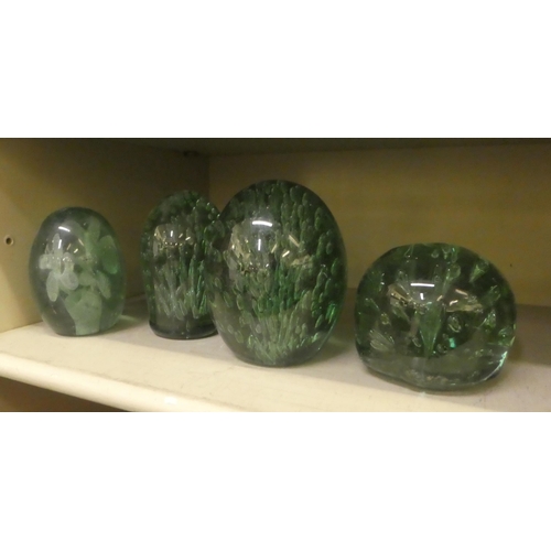 310 - Four late Victorian green glass dumps with bubbled decoration  largest 5