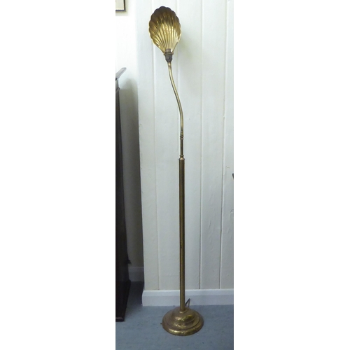 378 - A mid 20thC lacquered brass reading lamp with an adjustable scallop shell design shade  56