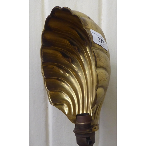 378 - A mid 20thC lacquered brass reading lamp with an adjustable scallop shell design shade  56