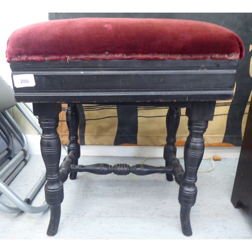 288 - An Edwardian black painted height adjustable music stool, raised on ring turned legs