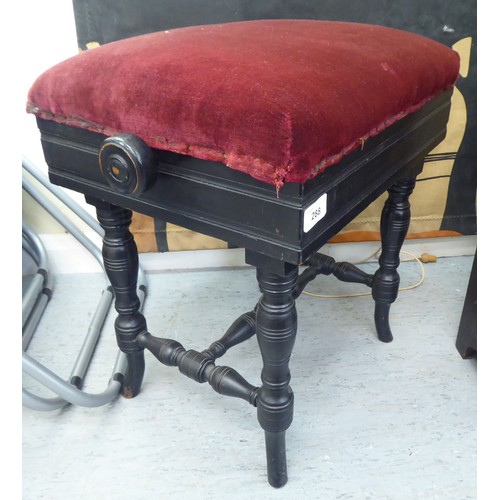 288 - An Edwardian black painted height adjustable music stool, raised on ring turned legs