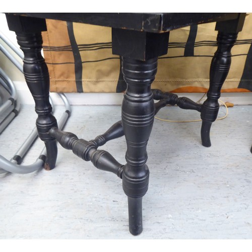 288 - An Edwardian black painted height adjustable music stool, raised on ring turned legs