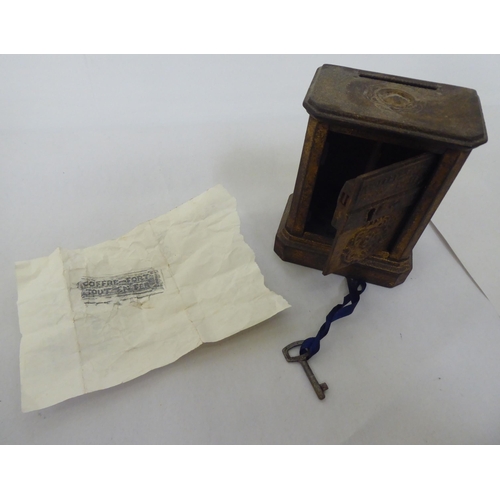 111 - A mixed lot: to include a cast metal moneybox, fashioned as a safe  3.5