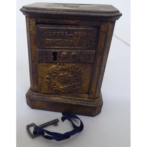 111 - A mixed lot: to include a cast metal moneybox, fashioned as a safe  3.5