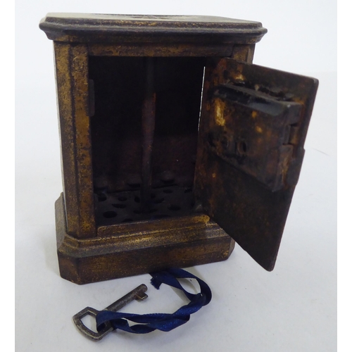 111 - A mixed lot: to include a cast metal moneybox, fashioned as a safe  3.5