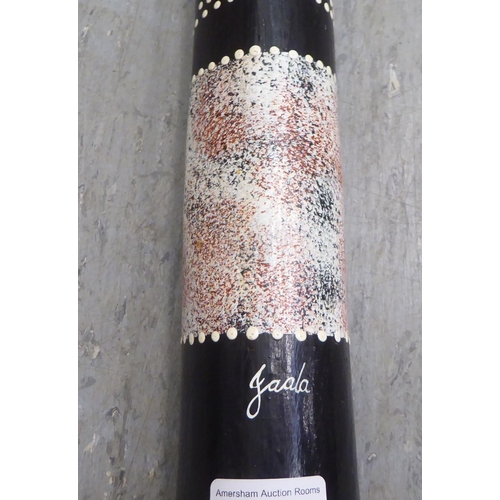 131 - An Aboriginal digeridoo with painted decoration  42