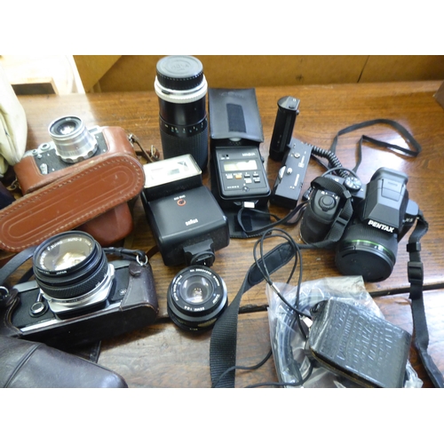 133 - Photographic equipment: to include an Olympus OM-1