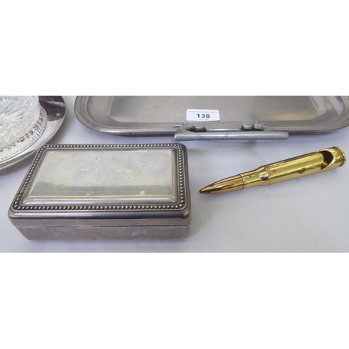 138 - Metalware: to include a silver plated cigarette box with a hinged lid  10