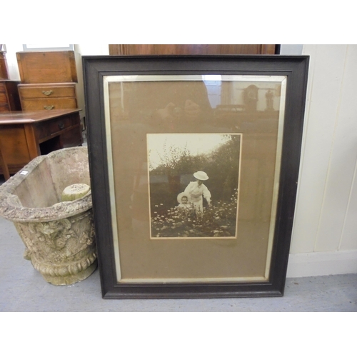 142 - Variously framed late 19thC and early 20thC photographs: to include a group of male athletes with a ... 