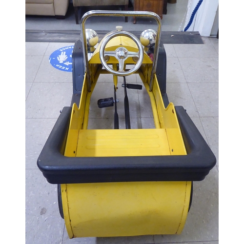 143 - A child's mid thC metal pedal car, decorated in yellow and black livery  36