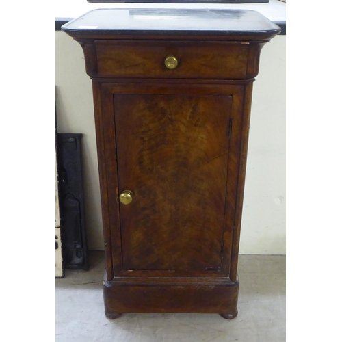 152 - A late 19thC Continental walnut pedestal pot cupboard with a black slate top, over a cushion moulded... 