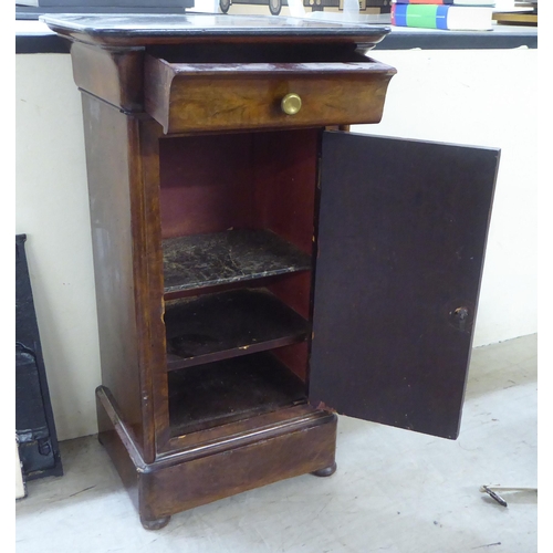 152 - A late 19thC Continental walnut pedestal pot cupboard with a black slate top, over a cushion moulded... 