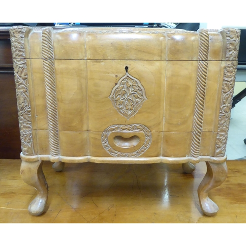 153 - A Kashmiri carved teak sewing box with a tray fitted interior  15