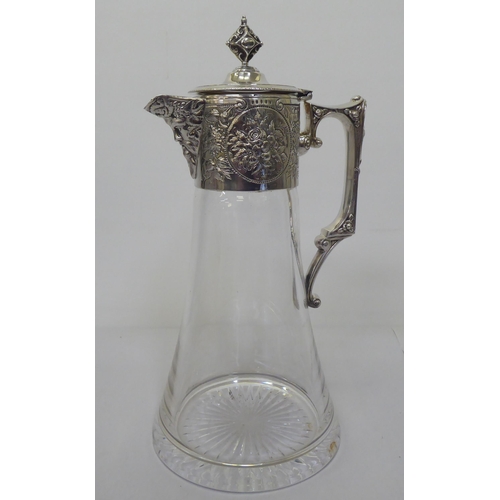 166 - A Victorian design glass wine jug of tapered form with engraved, chased and cast mounts, including a... 