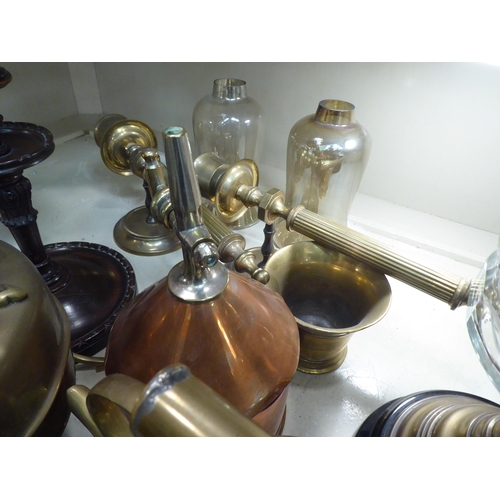 169 - Copper and brass items: to include an oil lamp, raised on turned wooden stand  25