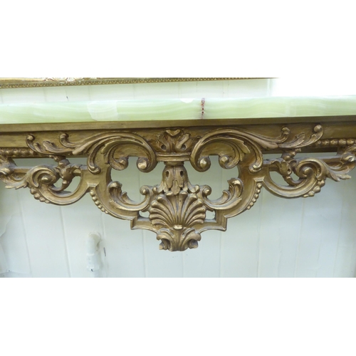 176 - A modern giltwood console table with a green onyx top, raised on cabriole legs  35