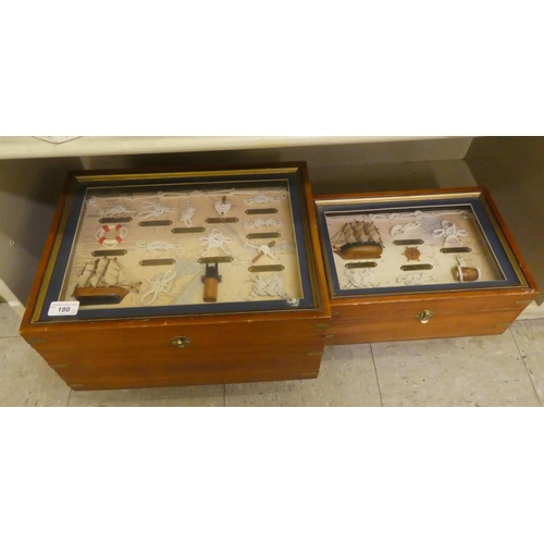 180 - Two brass bound glazed, mahogany boxes, containing nautical knots and model boats  largest 8