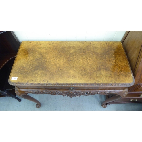 186 - A modern walnut hall table with a frieze drawer, raised on cabriole legs  32