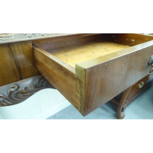 186 - A modern walnut hall table with a frieze drawer, raised on cabriole legs  32