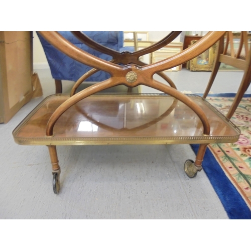 192 - A modern mahogany finished two tier tea trolley, on casters  27