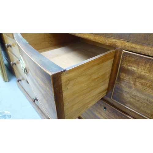 203 - An early 19thC mahogany bow front dressing chest with two short/three long drawers, raised on bracke... 