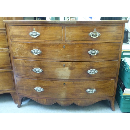 207 - An early 19thC mahogany bowfront dressing chest with two short/three long drawers, raised on bracket... 