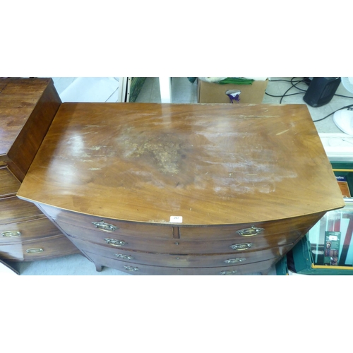 207 - An early 19thC mahogany bowfront dressing chest with two short/three long drawers, raised on bracket... 