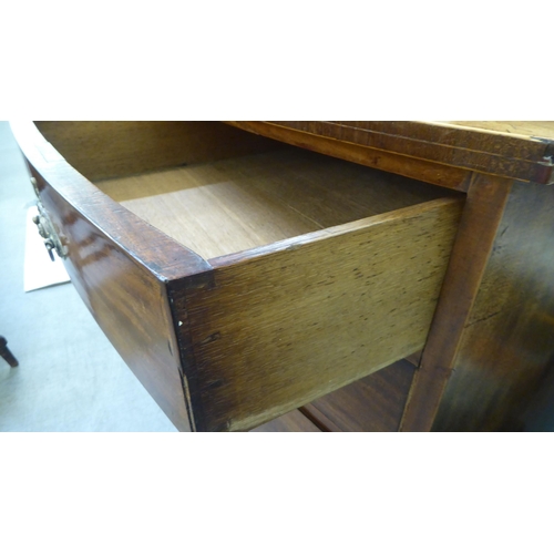 207 - An early 19thC mahogany bowfront dressing chest with two short/three long drawers, raised on bracket... 