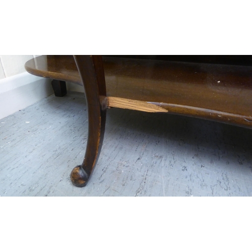 212 - A late Victorian mahogany display cabinet with a glazed door, flanked by open shelves, raised on cab... 