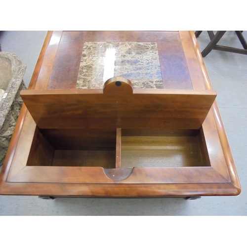 228 - A modern walnut finished coffee table with an arrangement of three drawers, raised on block feet&nbs... 