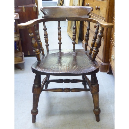 241 - A late 19th/early 20thC beech and oak captains desk chair  bears reference to one Captain Terri... 