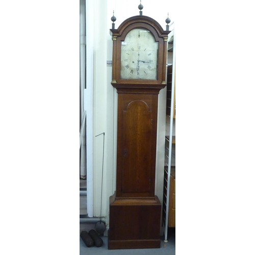 246 - An early 20thC oak longcase clock; the 8 day movement faced by a metal Roman dial  80