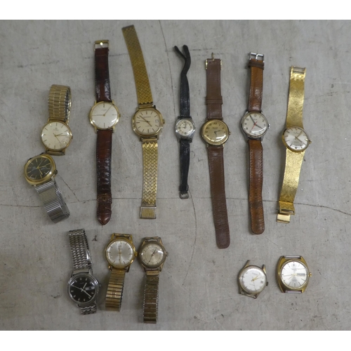 254 - Variously cased and strapped wristwatches: to include manual wind examples