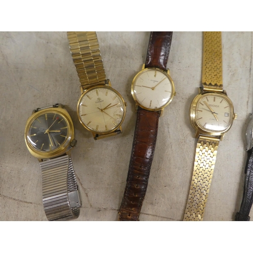 254 - Variously cased and strapped wristwatches: to include manual wind examples