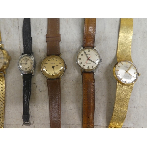 254 - Variously cased and strapped wristwatches: to include manual wind examples