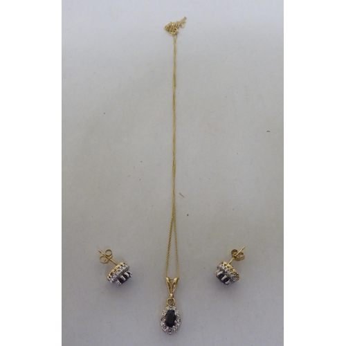 255 - 9ct bi-coloured gold jewellery, set with blue and white stones viz. a pendant, on a fine neckchain; ... 