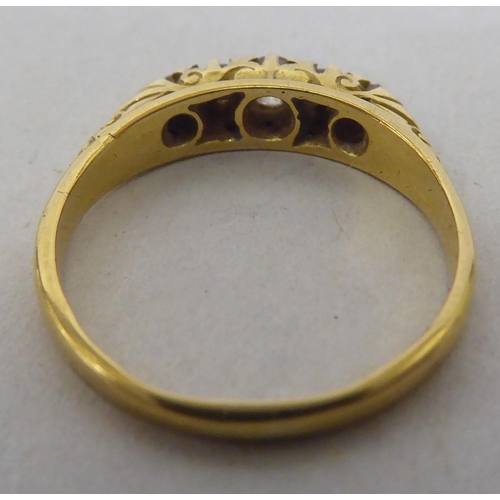 263 - An 18ct gold ring, set with five graduated diamonds