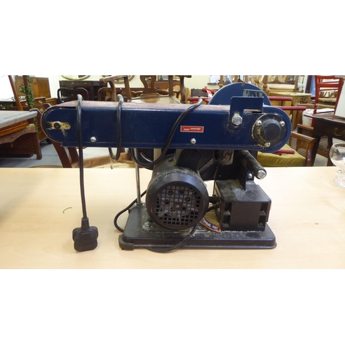 264 - A Powerline bandsaw; and a Ferm bench grinder 