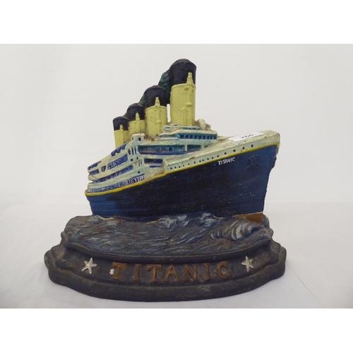 266 - A modern painted cast iron door porter, fashioned as the Titanic  10