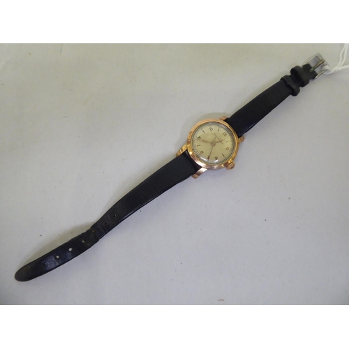 267 - A lady's Eterna-Matic gold plated, stainless steel cased lady's wristwatch, faced by a baton and Ara... 