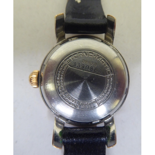 267 - A lady's Eterna-Matic gold plated, stainless steel cased lady's wristwatch, faced by a baton and Ara... 