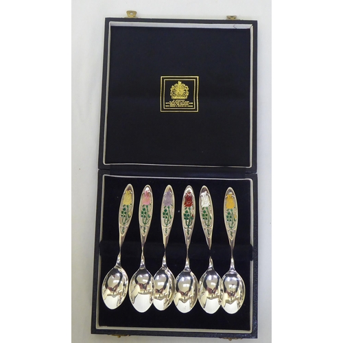 270 - A set of six silver 'Year of the Roses' themed teaspoons  Birmingham 1976  boxed