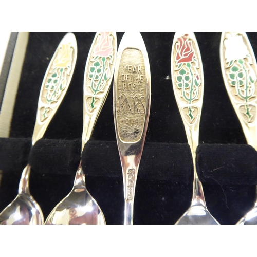 270 - A set of six silver 'Year of the Roses' themed teaspoons  Birmingham 1976  boxed