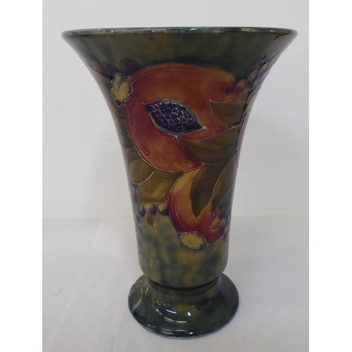 279 - An early 20thC Moorcroft pedestal vase in Pomegranate pattern, made for Liberty & Co  8.75