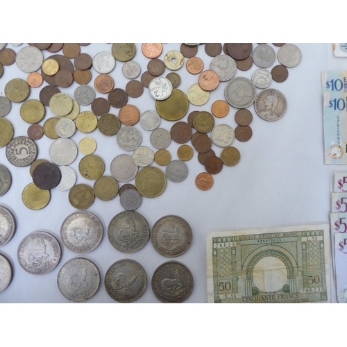 291 - Uncollated coins and banknotes: to include a 1940s South African five shilling 