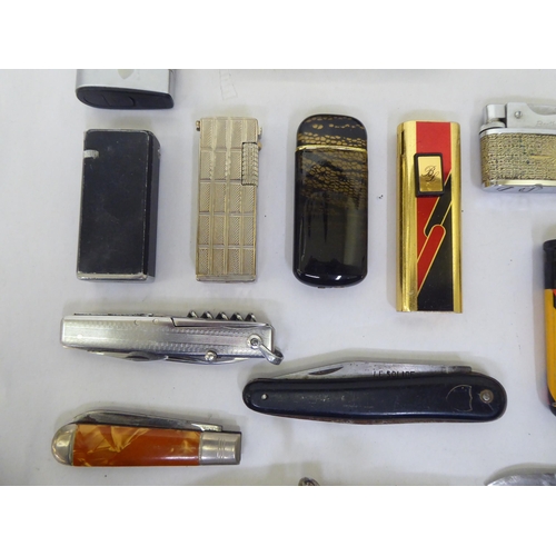 297 - A mixed lot: to include pens, lighters and green onyx smoking related accessories