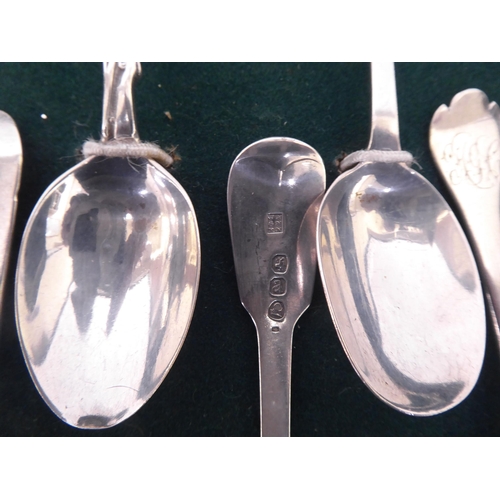 308 - A presentation case with a deep set, glazed oak door, containing silver teaspoons