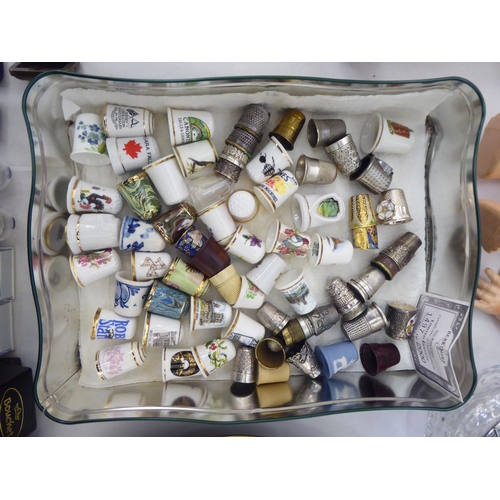 314 - A mixed lot: to include thimbles and thimble display cases  largest  17