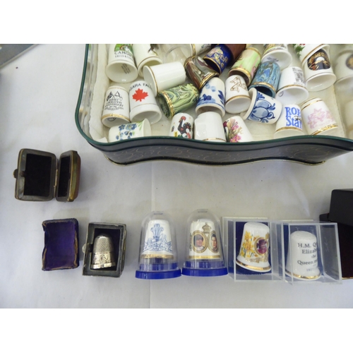 314 - A mixed lot: to include thimbles and thimble display cases  largest  17